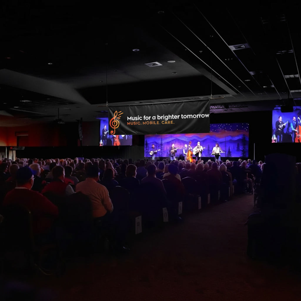 Music for a Brighter Tomorrow concert event with live bluegrass performance and seated audience